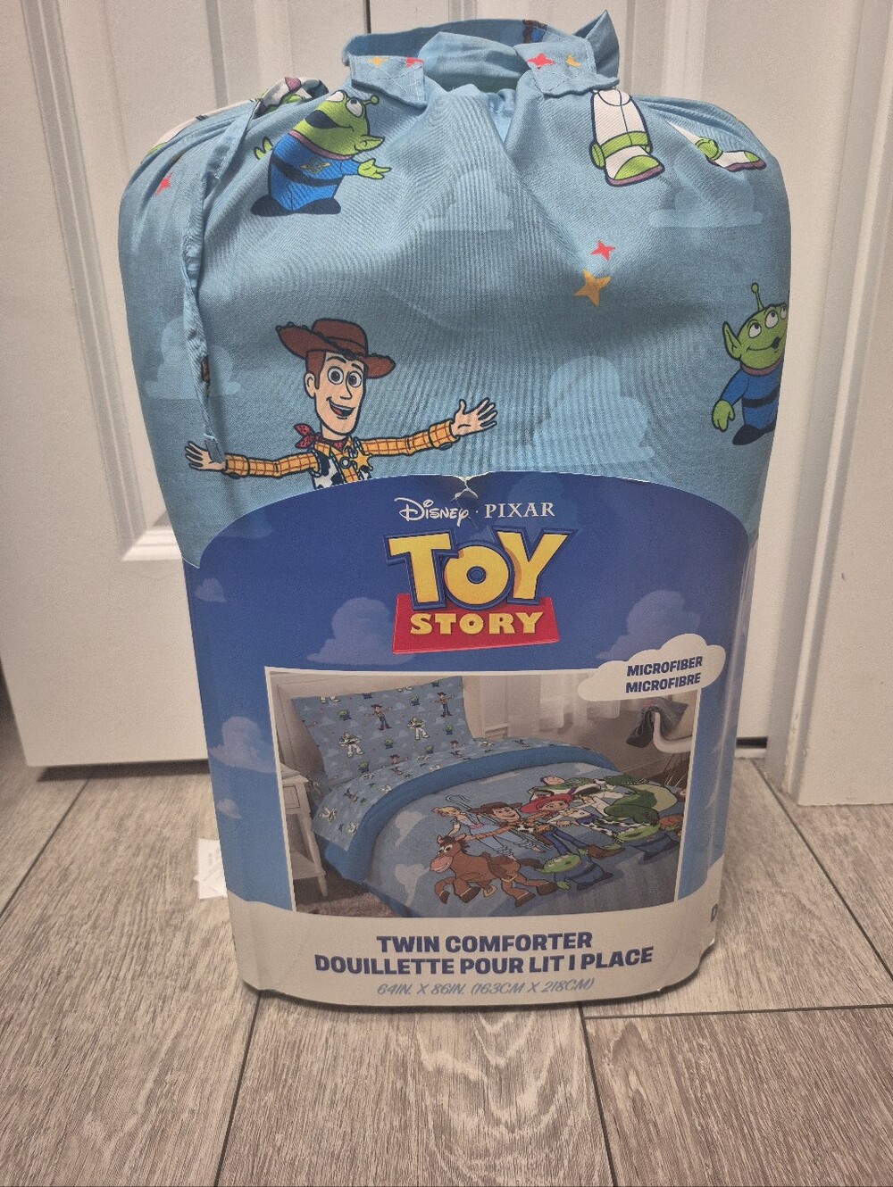 Disney Pixar New Toy Story twin comforter featuring Woody and Buzz Lightyear.